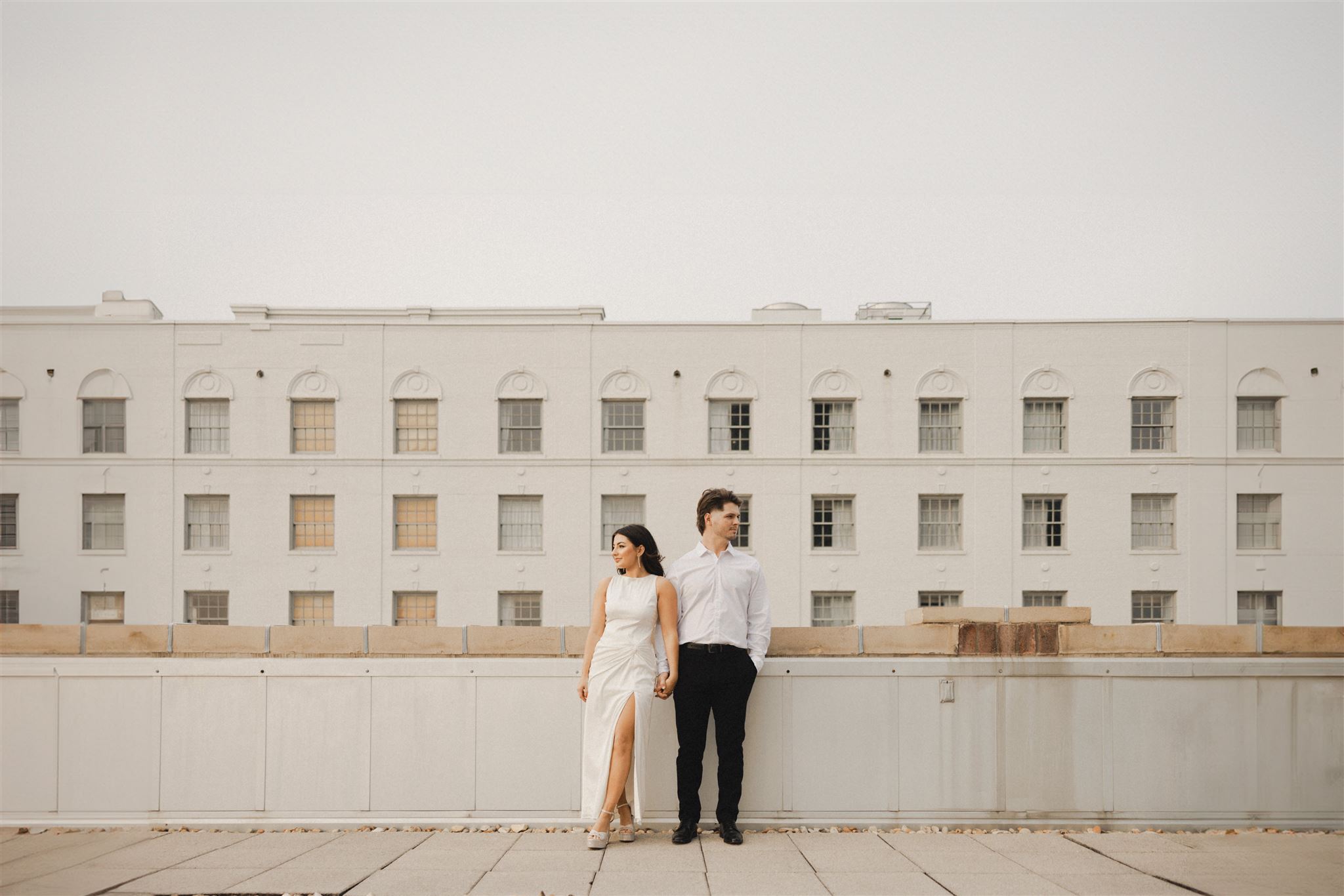 Couple standing on rooftop in downtown Baton Rouge